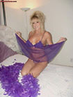 Sexy wife wearing purple babydoll nightie see-through bikini panties and 6-inch stiletto heels