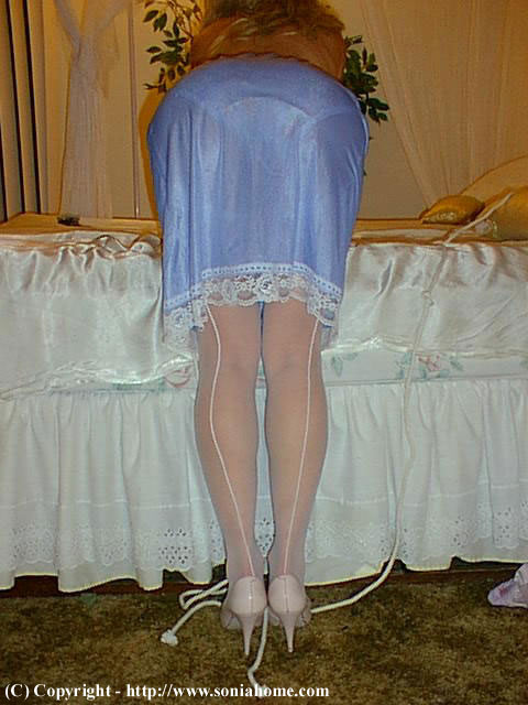sonia wearing a blue nylon half-slip with lace