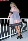 Sonia outdoors in a see-through nightie with black lace lingerie and full-cut nylon brief panties